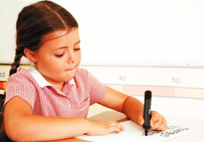 A little girl writing 