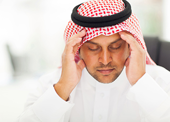 Man hands on his head felling headache dizzy 