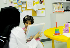 photo of female doctor talking to a patient girl