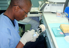 a dentist fixing dental molds