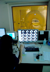 female healthcare worker doing MRI (Magnetic Resonance Imaging) machine for a patient